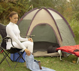 The picture of a Women who is on camping while wearing the shirt to protect herself from UV light and biting Insect.